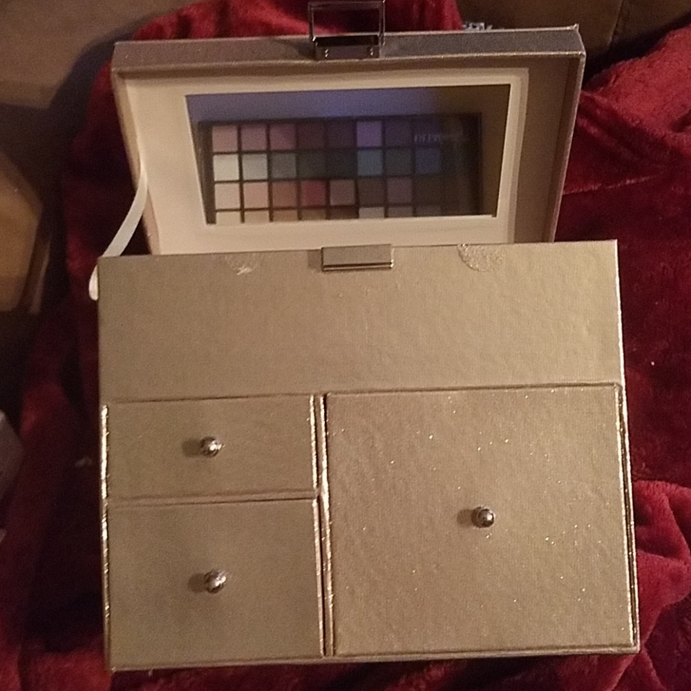 Ultra beauty mirrored case full of primers, gels,